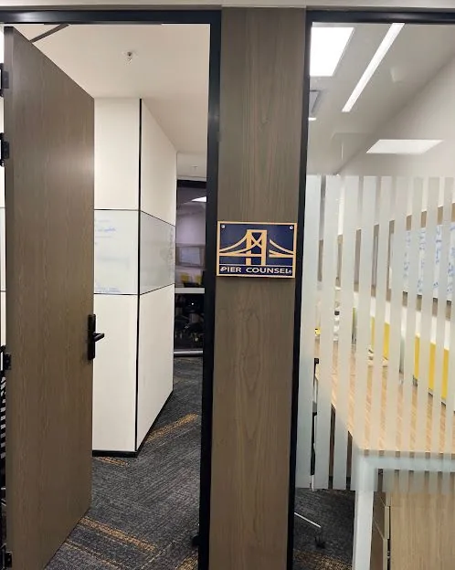 Entrance to a Pier Counsel office, with the firm’s logo on the wall